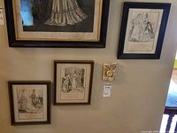 All four frames on wall; three lower prints show size and frames