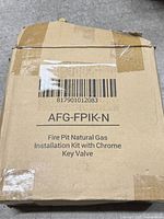 Closed carton showing model barcode AFG-FPIK-N