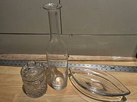 overview of jar, bottle, and leaf dish on floor