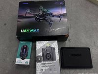 Boxed items: drone, camera, mouse, tablet