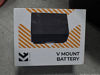 Front of sealed box showing product image and V Mount Battery text
