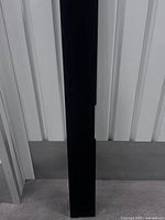 Full length view of black passive soundbar