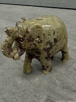 marble elephant figurine front and right side