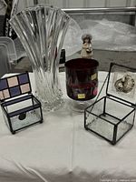 Group shot showing crystal vase, one ruby goblet, two stained glass trinket boxes