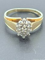 Top view of gold ring with diamond cluster