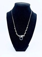 Full view of sterling silver necklace on display bust