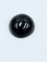 Front view of black star sapphire cabochon