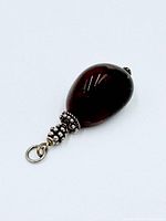 Full view of bloodstone pendant showing oval stone and silver fittings