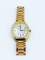 Front view of Bulova wristwatch showing dial, hands, date window, and bracelet