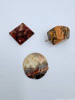 Group shot showing all three polished gemstones