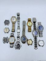 All twelve watches laid out showing variety