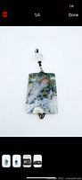 Front view of moss agate pendant showing slab and bead detail