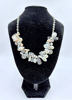 Necklace on stand showing clustered bead front design