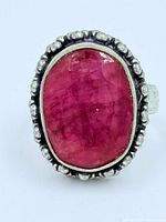 Front view showing ruby and silver beaded border