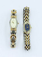 Both Seiko watches front view showing dial designs and bracelets