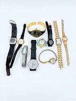 Group shot of all ten wristwatches laid out showing variety of styles