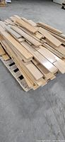 Top view of stacked wood flooring pieces on pallet