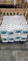 Full pallet showing multiple packages of Compliments Ultra paper towels