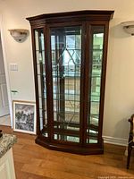 Full view of curio cabinet front and side