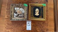 Two framed medallion plaques side by side