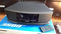 Front view of Bose Wave SoundTouch on box with remote