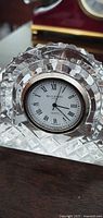 Front view of Waterford crystal clock showing dial and cut pattern