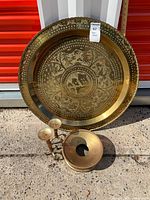 Group shot of brass tray, two candlesticks, shallow candle holder