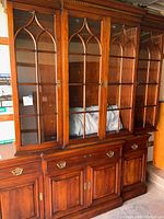 Full view of cabinet showing upper glass doors and lower buffet