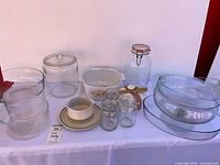 Full view of all glass bakeware, jars, ceramic pieces and spreader