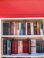 Full view of three shelves showing majority of hardcover books