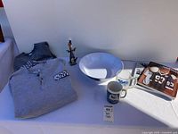 Overall lot: sweatshirts, figurine, bowl, mugs, yearbook