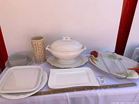 Full lot showing tureen, platters, vase, bowls and saucer