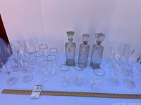 Full lot showing decanters, glass and plastic stemware