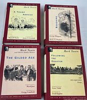 Front view of all four volumes showing titles and uniform design