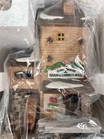 Front view of porcelain mill inside Styrofoam and plastic