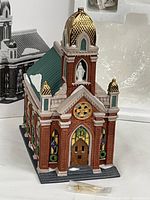 Full view of Holy Name Church porcelain building front and side