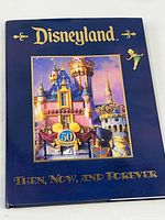 Front cover of the Disneyland: Then, Now, and Forever hardcover book