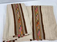 Folded view showing full width, stripes and diamond motifs