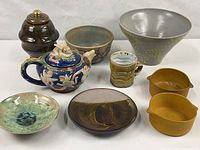 All ten pottery pieces arranged together