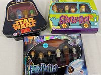 All three unopened Pez collector sets together