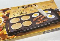 Front of sealed Presto 07030 Cool Touch Griddle box showing product image