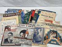 Group of assorted vintage sheet music, Liberty Magazine visible