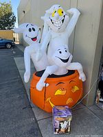 Full view of assembled inflatable showing three ghosts and jack-o-lantern