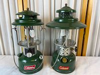 Both Coleman lanterns side by side showing overall condition