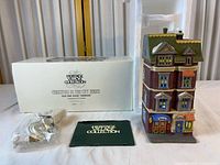 Building, box, light cord and booklet displayed