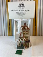 Box lid showing Heritage Village Collection Dickens’ Village Series Green Gate Cottage limited edition details