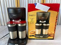 Coffee maker, two mugs, power cord, box