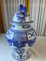 Full view of temple jar showing shape, patterns and lid