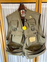 Full view of Columbia fishing vest with accessories visible