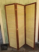 Front view of three-panel faux bamboo folding screen